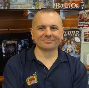 Litlte Shop of Magic owner John Coviello standing in his store.
