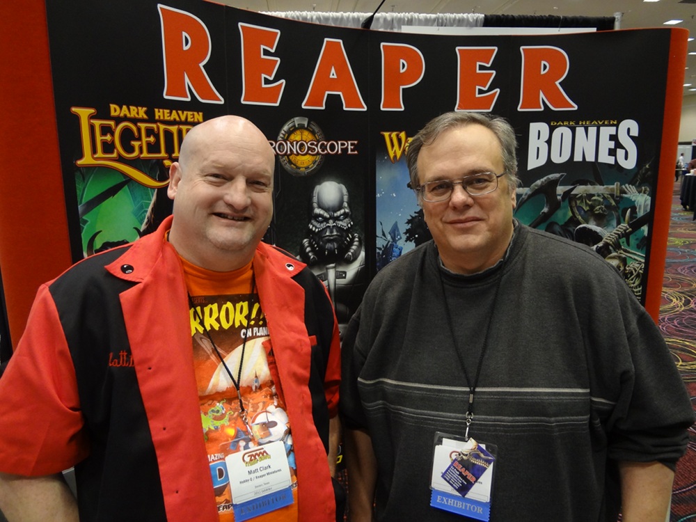 Ed Pugh and Matt Clark from Reaper Miniatures pose at the Reaper booth at the GAMA Trade Show 2012.