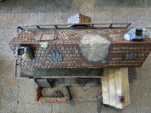 A view from above of the weathered and worn miniature fantasy inn.