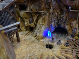 Glowing blue crystals illuminate a mining cave complex for Dark Age Games