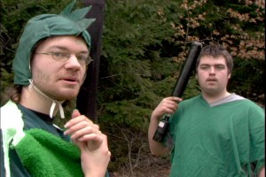 Two LARPers dressed up in green costumes as either lizardmen or finfolk