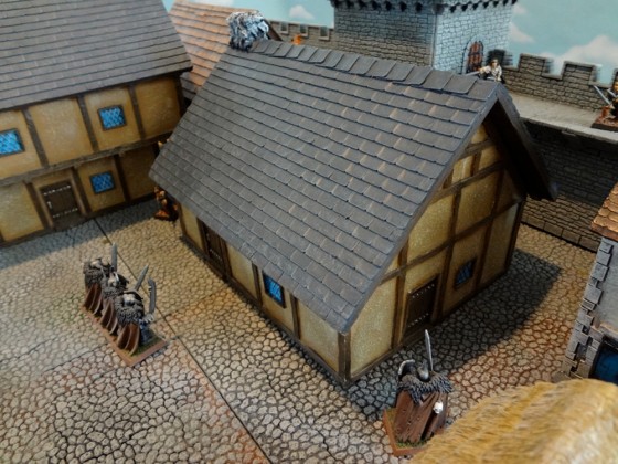 The 8 inch by 6 inch large prepainted miniature house from Pegasus Hobbies has a Tudor feel to it