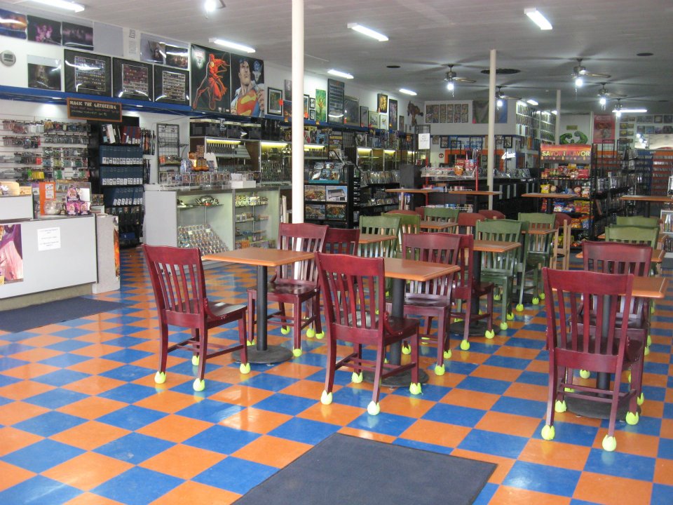 Orange and blue checkerboard floor at Titan's Entertainment Cafe with over 300 board games