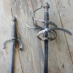 The hilts and blades of a sword and a dagger custom-made by David Baker