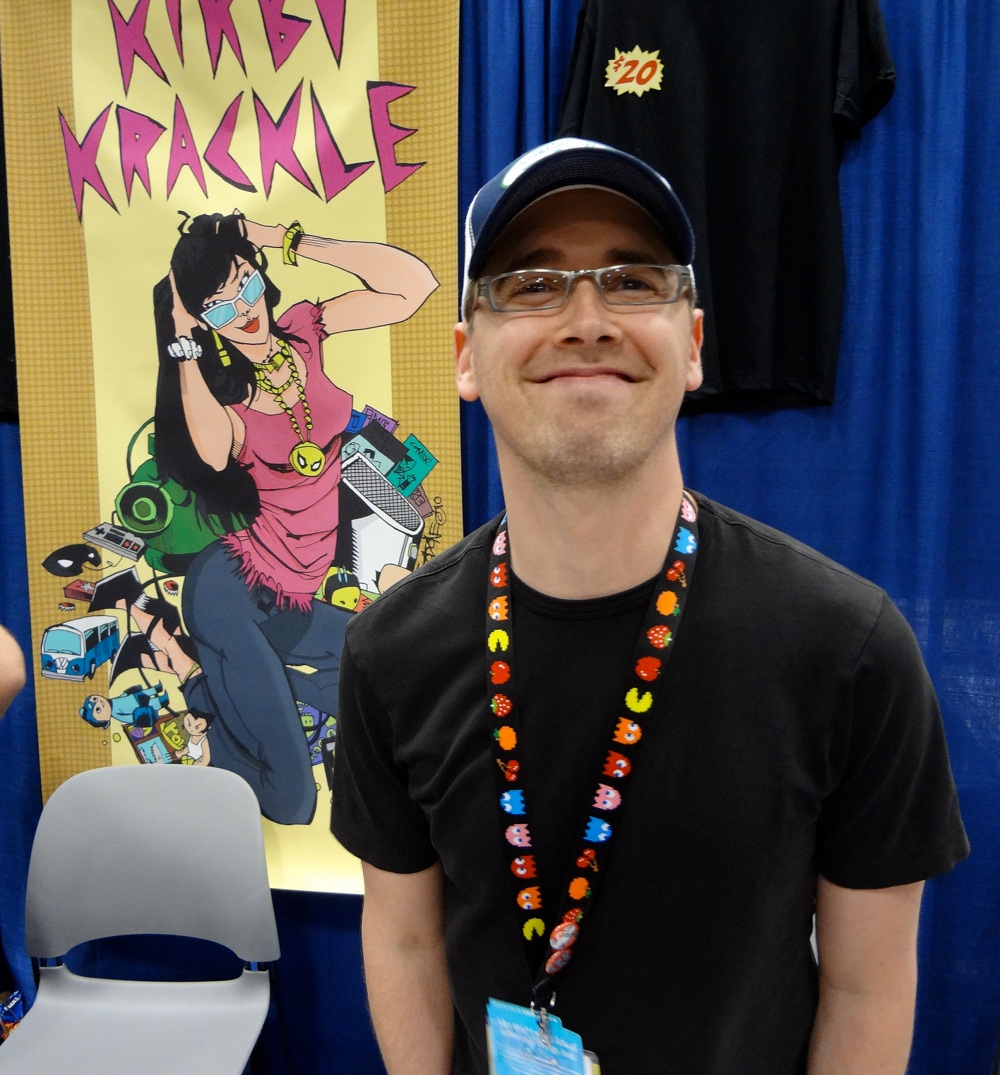 Kyle Stevens with Pac Man lanyard at Comic Con 2012 in the Kirby Krackle booth