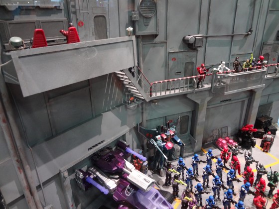 Looking down on Starscream and Shockwave as a H.I.S.S. in a GI Joe diorama at Comic-Con