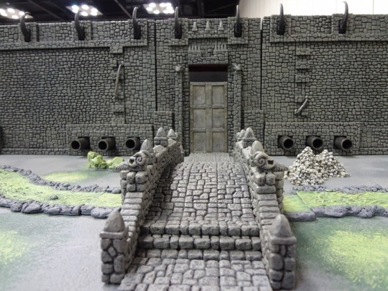 Hirst Arts plaster floor tiles and bricks arranged to create a castle or fortress at Gen Con 2012