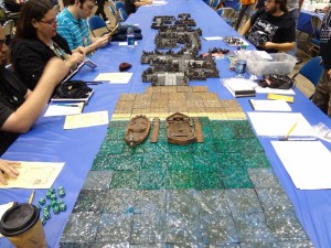 Players get ready to play on Hirst Arts and custom terrain from Legendary Realms at Gen Con gaming table