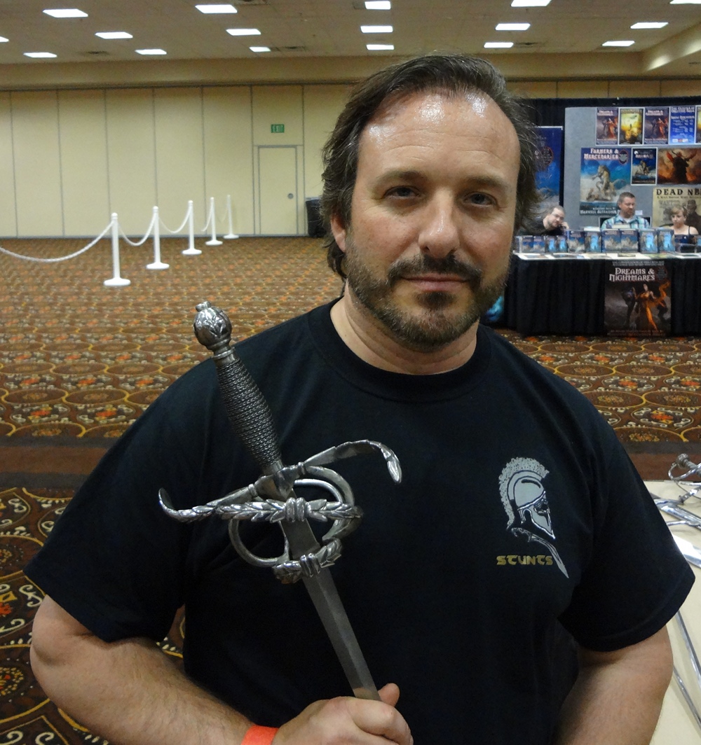 Western Martial Artist Luke Lafontaine with a Sword in Hand in Vendors' Hall at Combat Con