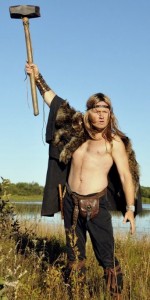 Actor Mark Krupa dressed in fur and leather wielding Mjolnir hammer in the Wild Hunt as Bjorn Magnusson