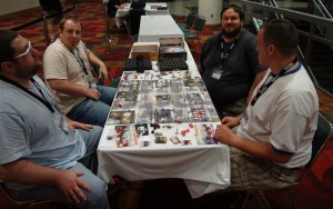Four players at Gen Con enjoying the zombie horror board game Zombicide