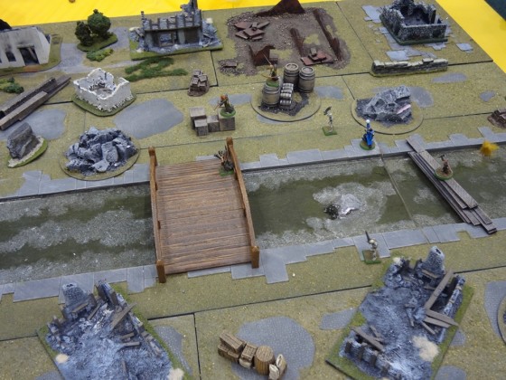 Small skirmish Mordheim warbands battle through ruined city streets in 28mm scale