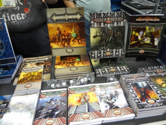 Roleplaying game manuals at Triple Ace Games booth at Gen Con 2012