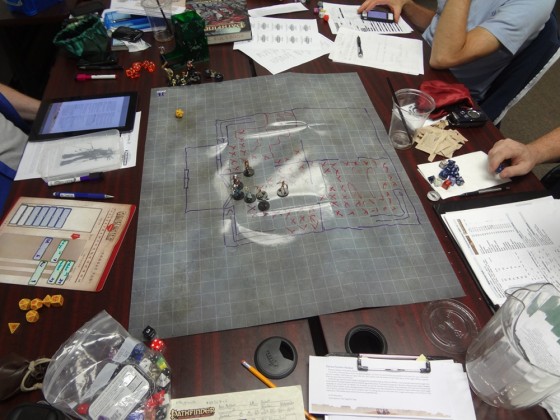 Gaming mat with picture drawn of Absalom granary for Pathfinder adventure Silent Tide with miniatures