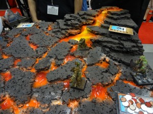 Realistic 28mm scale orange lava flowing over miniature terrain board for Confrontation at 2012 Gen Con
