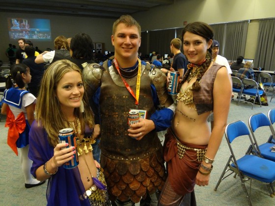 Belly dancers flank a knight in armor from the Adrian Empire at San Diego Comic-Con 2012