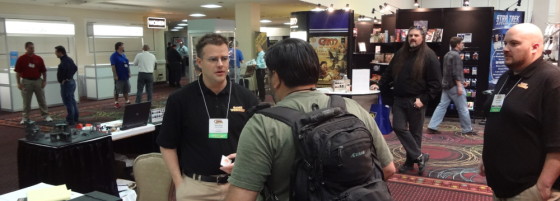 GW Employee Andre Kieren speaking with GTS Attendee at GW booth in Bally's Convention Center