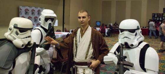Shaved head Jedi Crow Shadowfire waves his hand to pass through Stormtroopers at Exhibition Hall at Las Vegas Comic Expo