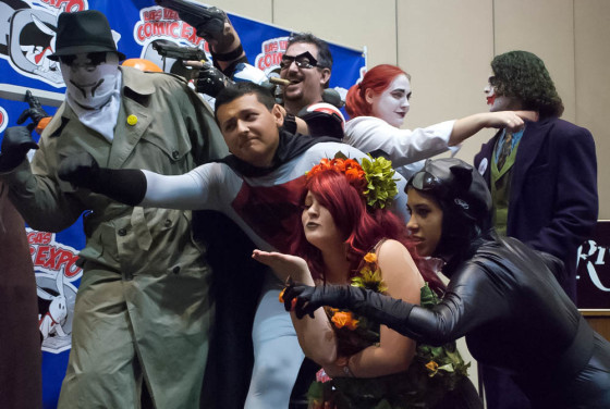 Cosplay Contest at Las Vegas Comic Expo with DC characters Red Son Superman, The Comedian, Poison Ivy blowing a kiss, Catwoman, The Joker, Harley Quinn, and Rorshach