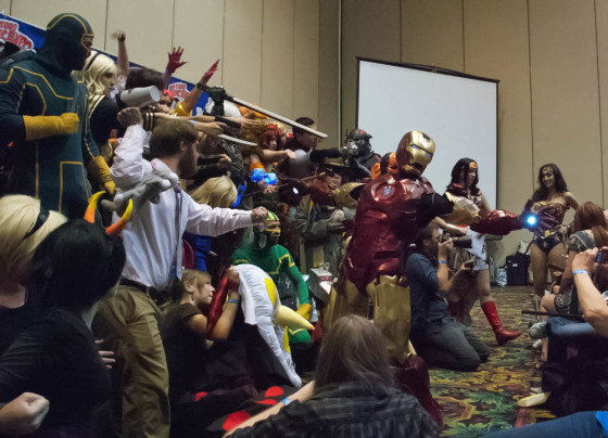 Cosplay Contest at Las Vegas Comic Expo with Iron Man standing in Front with Palms Lit up By Lights