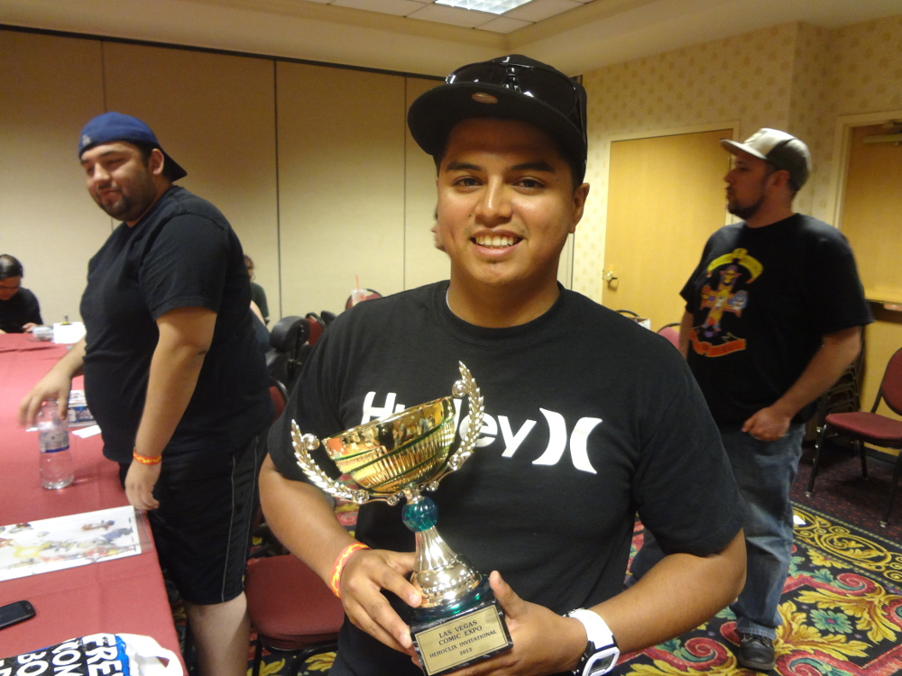 Victorious Heroclix player Justin Jimenez with the 2013 Vegas ROC Trophy at the Las Vegas Comic Expo